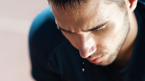 Man sweating because of high wet bulb globe temperature