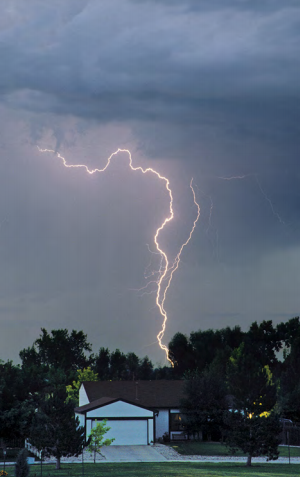lightning striking a home