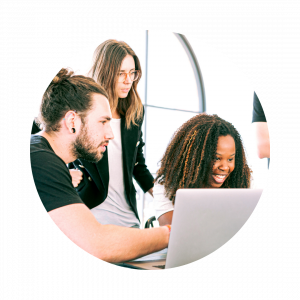 Three, young intelligent-looking professionals collaborating on laptops
