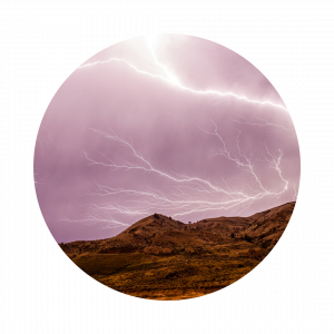 lightning striking over a mountain