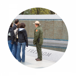 Park ranger showing guests around at a war memorial