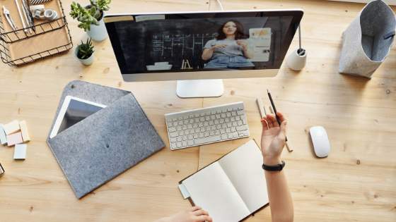 A student asking a question to their remote teacher via video conference