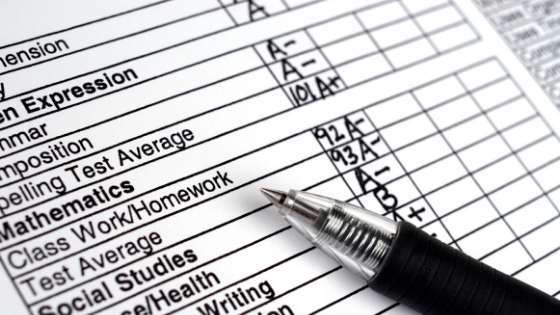 a report card with various grades